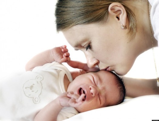 Mum kissing crying baby; Shutterstock ID 62713735; PO: The Huffington Post; Job: The Huffington Post; Client: The Huffington Post; Other: The Huffington Post